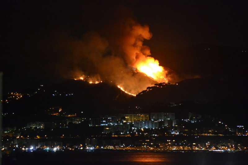 mountain above neighborhood on fire