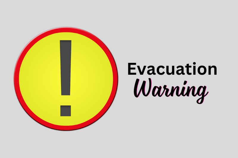 Graphic with bold text reading ‘Evacuation Warning’ next to a large exclamation point icon, signaling the need for heightened awareness and preparation.